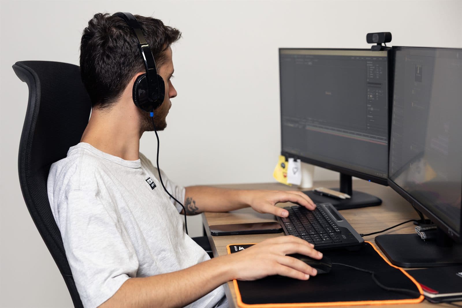 A specialist at a dual-monitor workstation